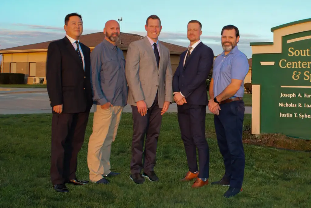 New Exterior Photo without Kutzner 5 New Team without Kutzner and building FINAL